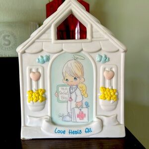 Precious moments love heals all